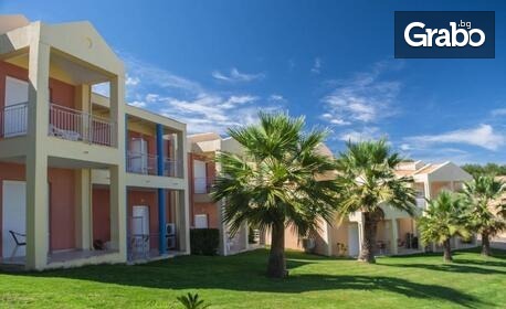 Наслади се на остров Корфу: 4 нощувки със закуски и вечери в хотел Olympion Village 3+*, Кавос, плюс транспорт